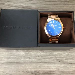 Rosegold, blue face Michael Kors slim runway watch